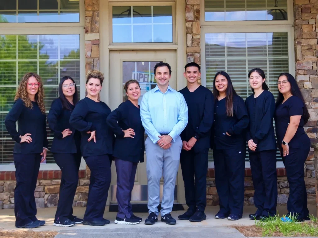 Dr. Zohrabyan and the full Sugarloaf Smiles team outside the Duluth, GA office | Dentist in Duluth, GA